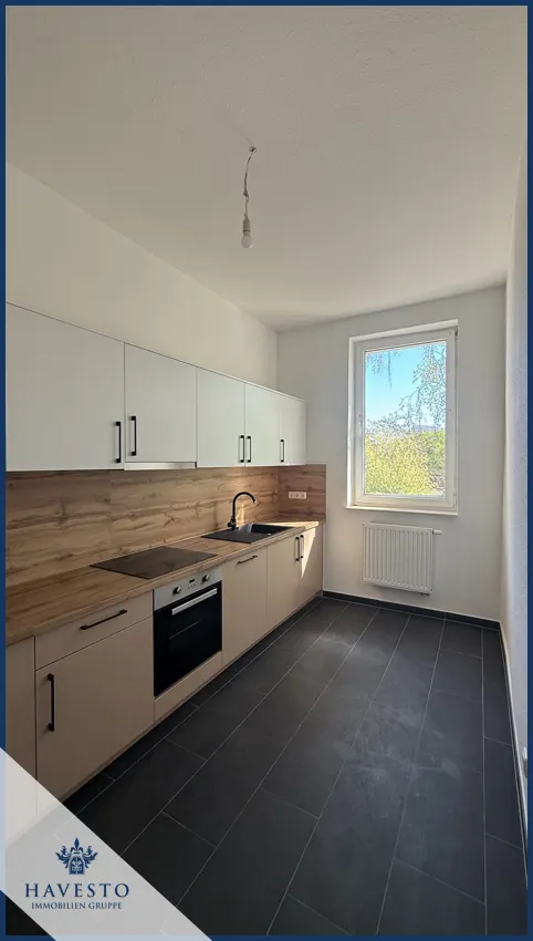 Moderne Traumwohnung mit Design-Einbauküche, Badewanne & großen Fensterflächen – perfekt für Singles - Foto 2