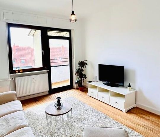 Wohnzimmer mit Balkon
