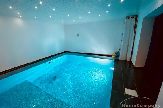 Außergewöhnlicher Designer-Bungalow mit Indoor-Pool, Heimkino & Smart-Home in ruhiger Naturlage