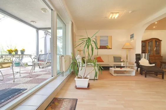 Modern and spacious living space. Completely renovated ground floor apartment with garden and patio in excellent, sought-after residential area, yet still centrally located
