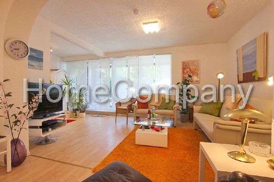 Modern and spacious living space. Completely renovated ground floor apartment with garden and patio in excellent, sought-after residential area, yet still centrally located