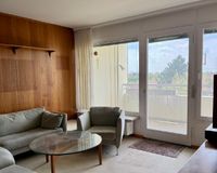 Wohnzimmer mit Zugang zum Süd-West-Balkon