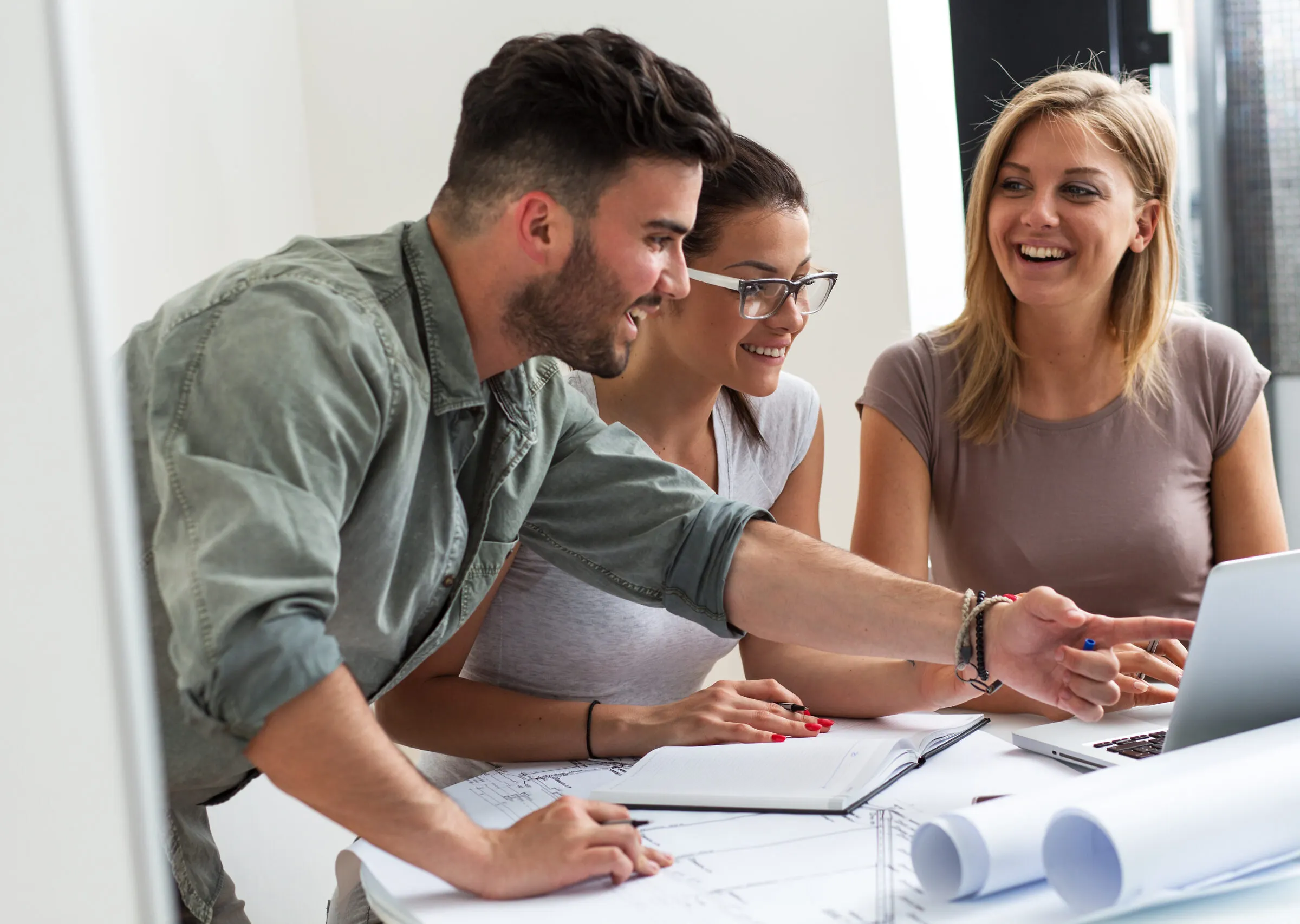 Architects in office working on  new construction project