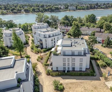 Moderne 3-Zimmer-Wohnung mit eigenem Garten direkt am Rhein!