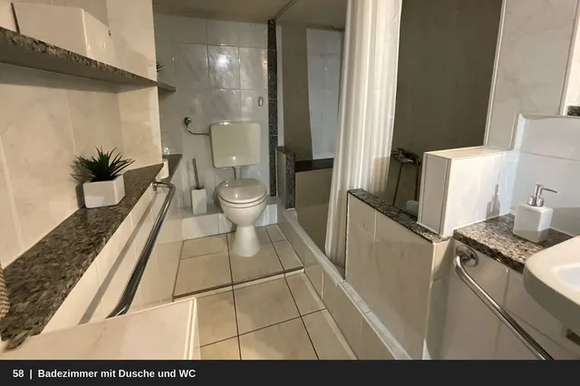 58_Badezimmer_mit_Dusche_und_WC